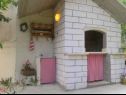 Apartments Viki - seaview & garden terrace: A1(6) Makarska - Riviera Makarska  - fireplace