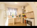 Apartments Tirkiz - 80m from the sea: A1 Mia (2+1), A2 Marija (6), A3 Klara (4) Rogac - Island Solta  - Apartment - A1 Mia (2+1): summer kitchen